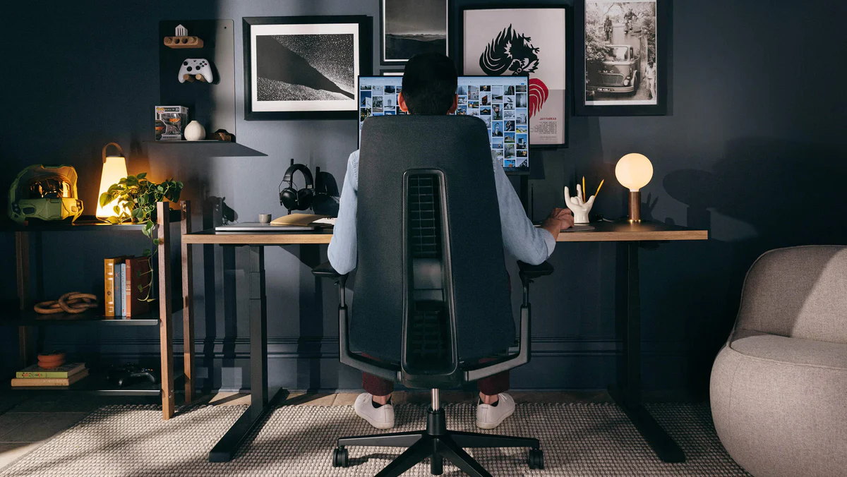Minimal office desk workspace with monitor and ergonomic chair setup