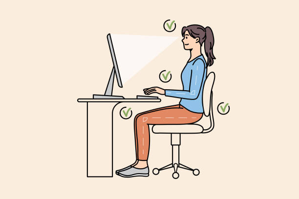 Diagram showing proper seated posture alignment at an office desk